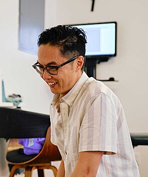 Dr. Leo smiling during a chiropractic appointment at Source Chiropractic in downtown Toronto.