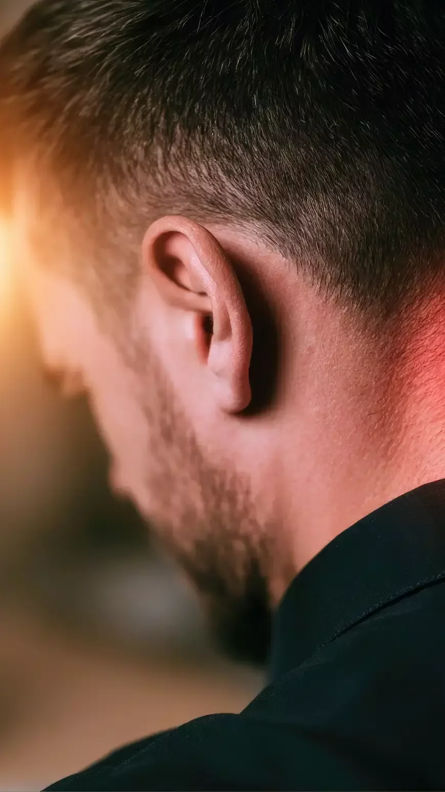 Close-up of the back of a person's neck highlighting the upper cervical region where neck pain is commonly felt.