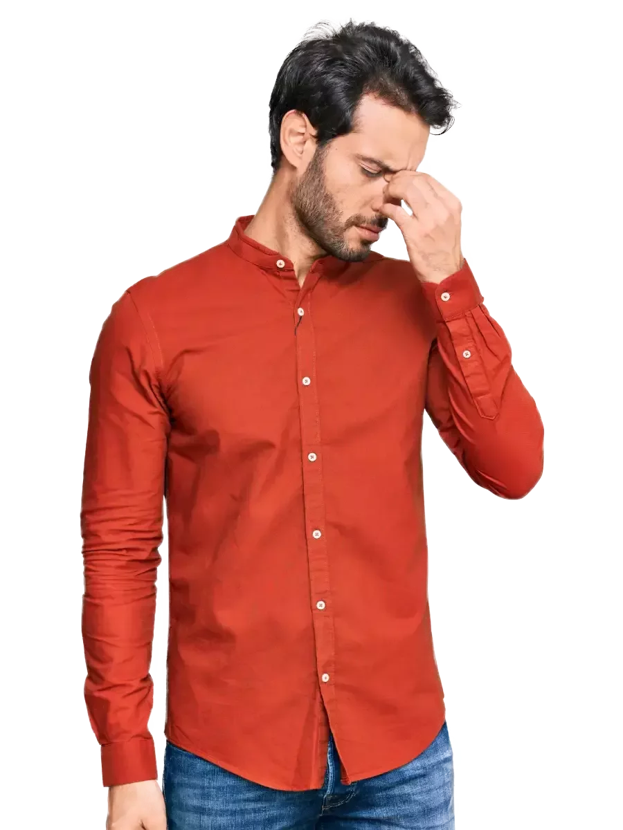 Man experiencing headache and pressure behind the eyes